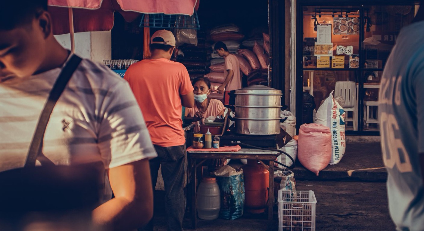 Vendors and shoppers at a Philippine public market